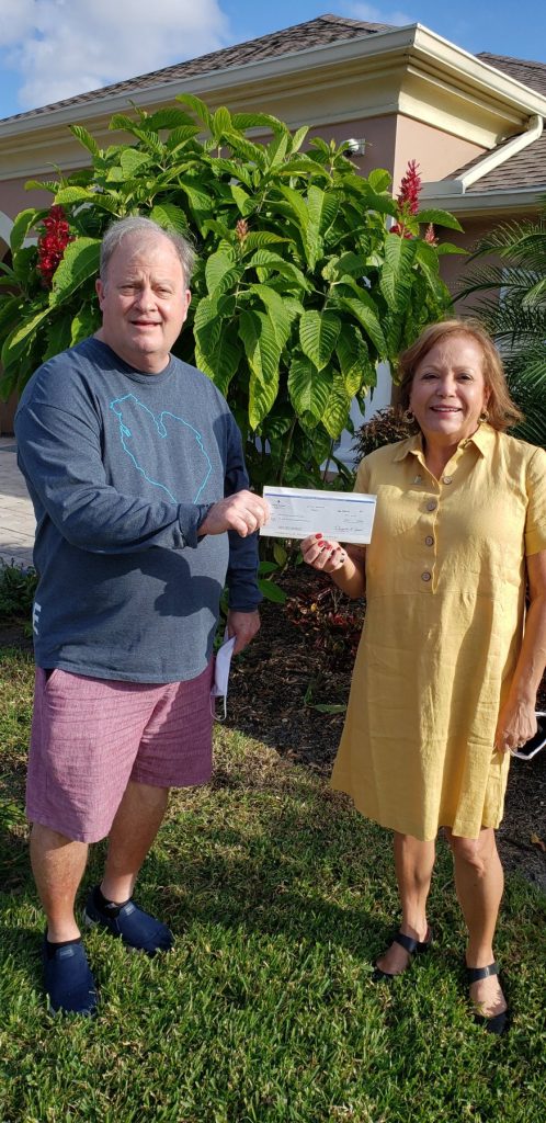 Jim Doss with a community partner, 2020